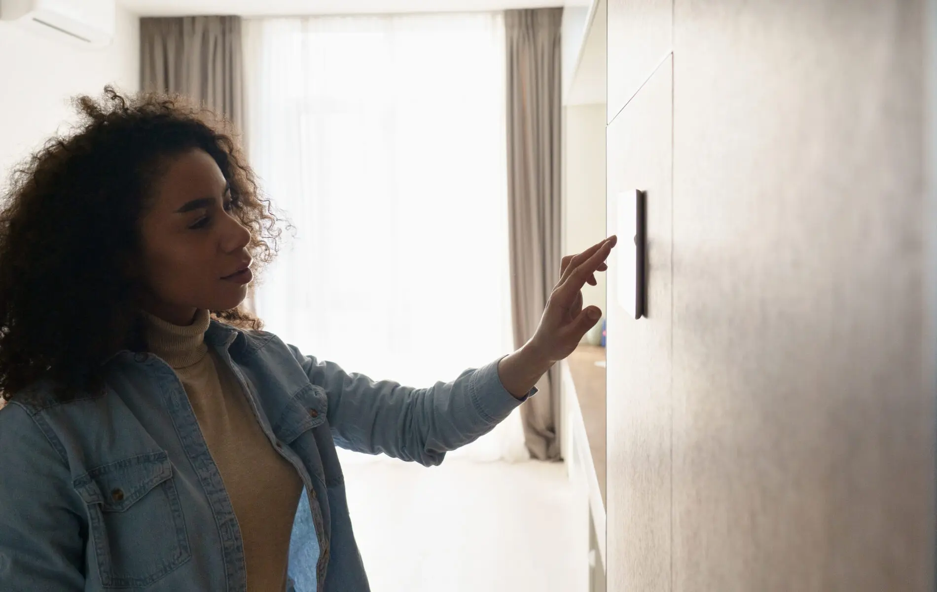young african girl setting remote control